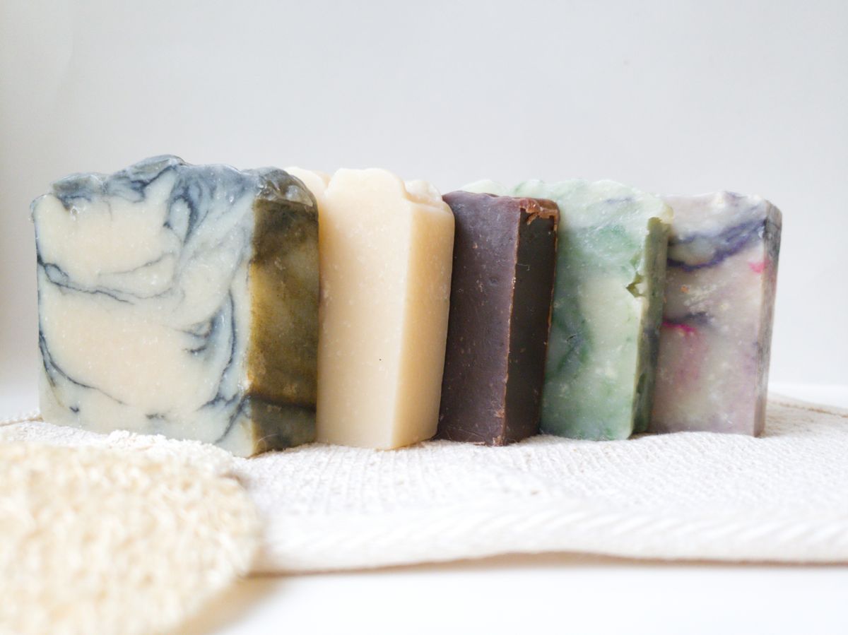 A row of colourful handmade cold-process soap bars